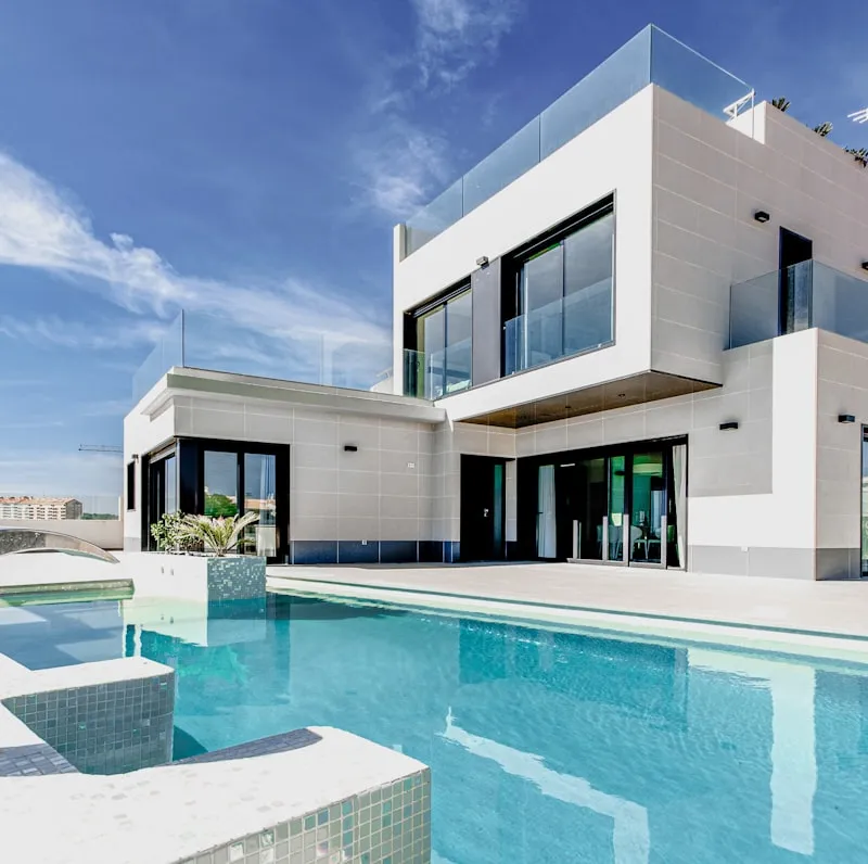 Modern house with flat roof showing tile and surface conditions