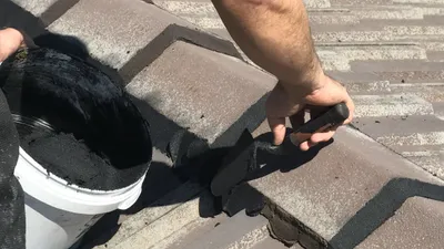Fresh flexible pointing applied to ridge caps on a Perth tile roof