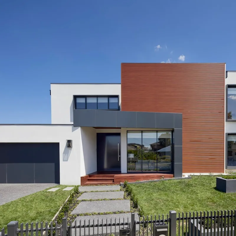 Modern home with visible roof structure and cladding