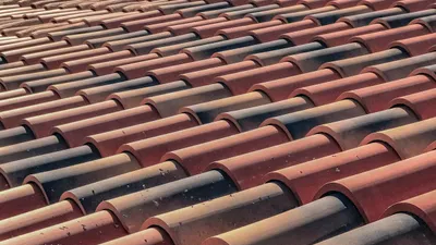 Weathered terracotta roof tiles on an established Perth home before restoration