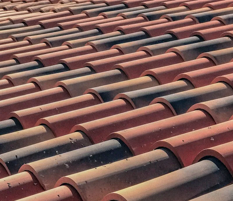Weathered terracotta roof tiles on an established Perth home before restoration