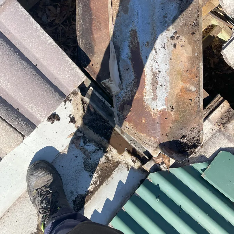 Rusty metal roofing component showing corrosion on a Perth home