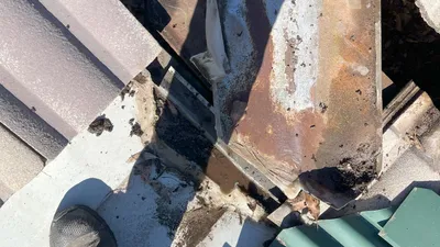 Rusty metal roofing component showing corrosion on a Perth home