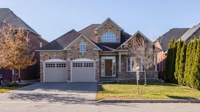 Suburban home with visible roof requiring seasonal maintenance